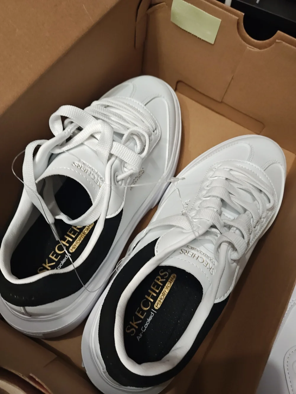 Skechers Men’s White Sneakers with Black Heel Accent 9